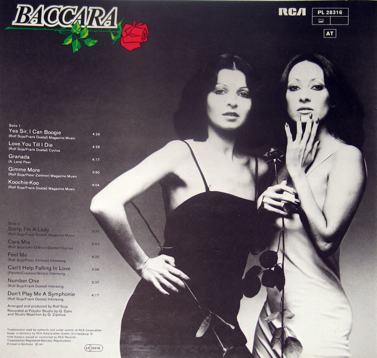 Back cover of Baccara’s self-titled album featuring a black-and-white photograph of the duo. One member wears a black dress, and the other a white dress, both holding a long-stemmed rose. The Baccara logo with a red rose and green vine is in the top left corner, with the RCA logo and catalogue number in the top right. Tracklisting is displayed on the left side, with production and copyright details at the bottom.